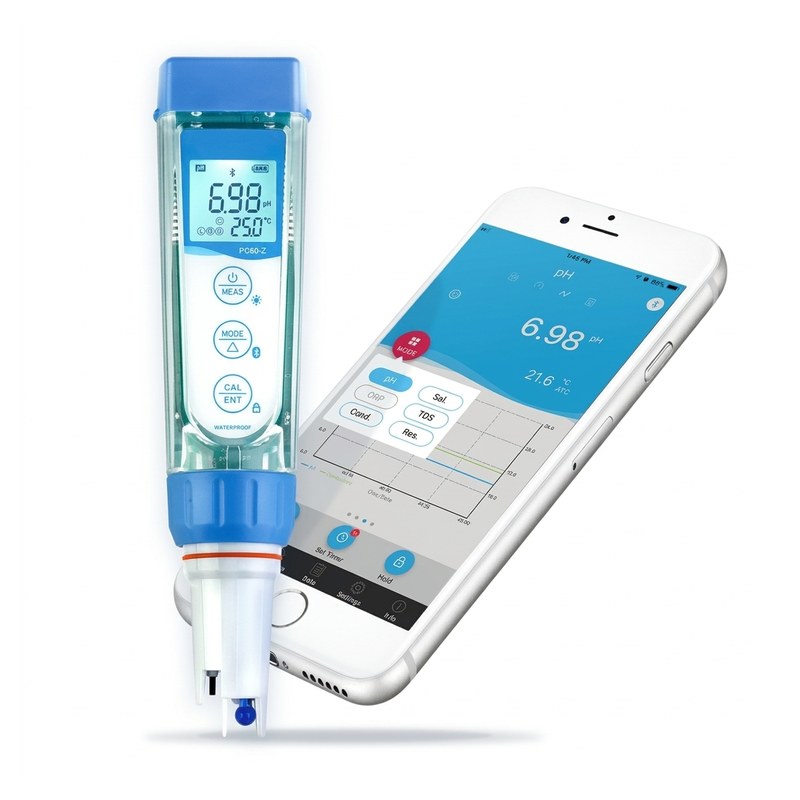 Testeur multiparamètre bleu ZenTest à côté d'un smartphone affichant l'application